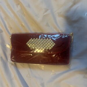 Elegant Burgundy Clutch with Gold Accents